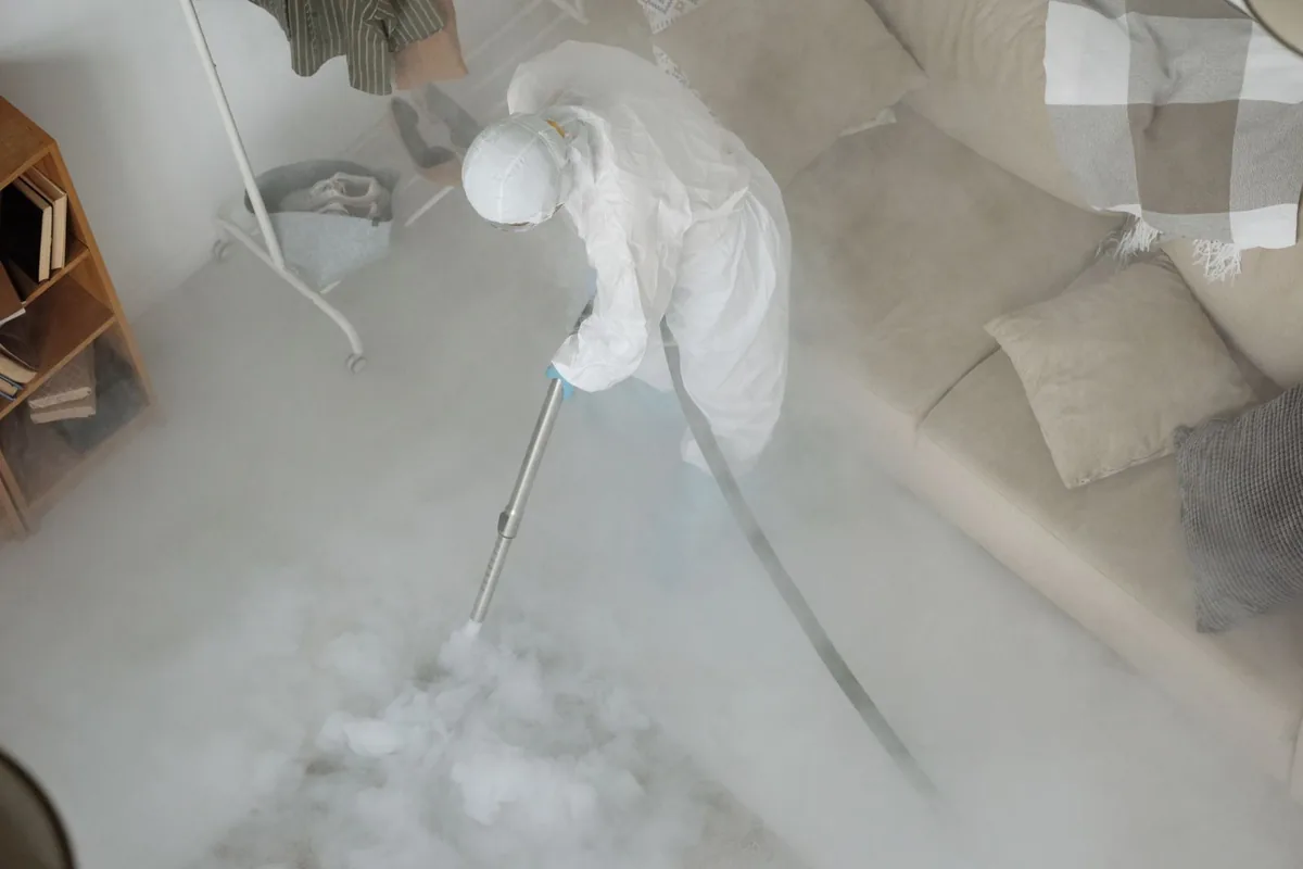 Biohazard cleanup technician in protective equipment, Colfax, WI